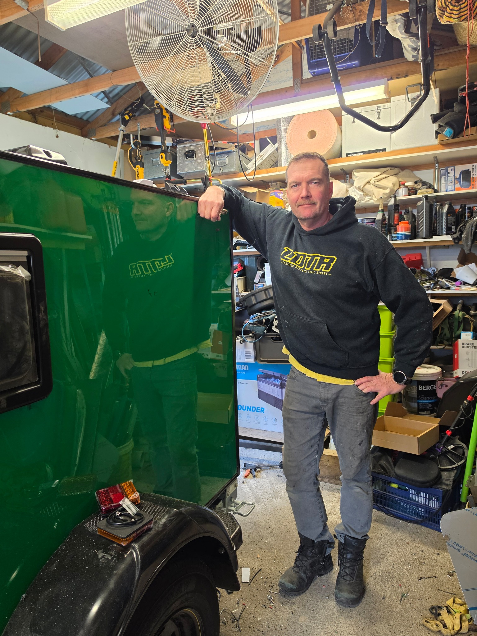 Derek beside a Mini Camper under construction Derek standing beside a Mini Camper under construction in his workshop
